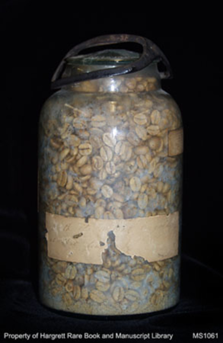 A glass jar of coffee beans