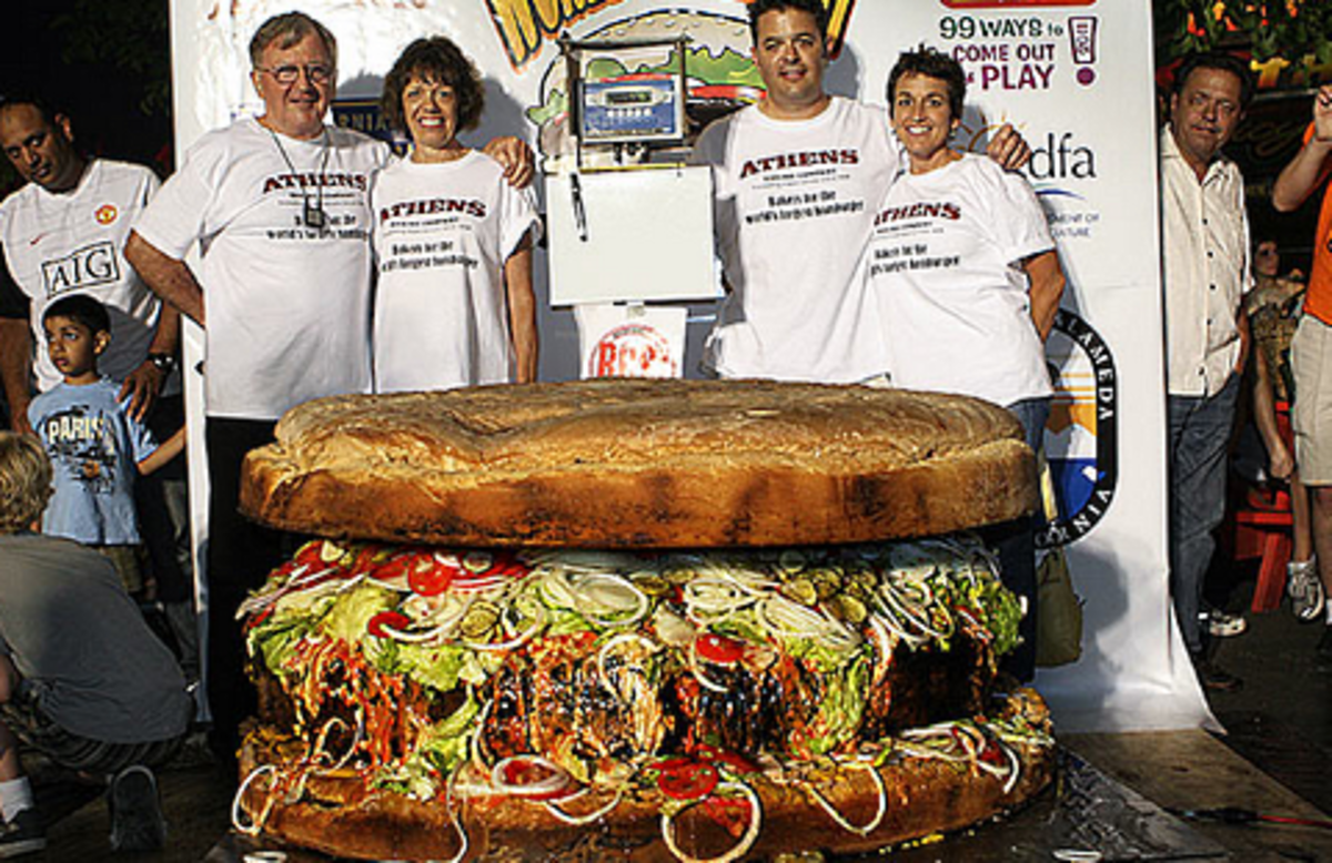 The burger created by Juicys Foods & Ovations Foodservices currently holds the record for the world' s largest commercially available hamburger at 352.44 kg. It would take a single person 22-months to finish if adhering to a 2,000 calorie-a-day diet