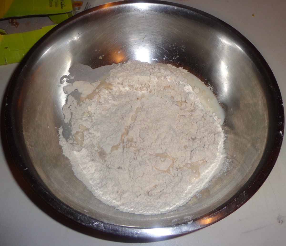 In a large bowl flour, salt and milk are added.