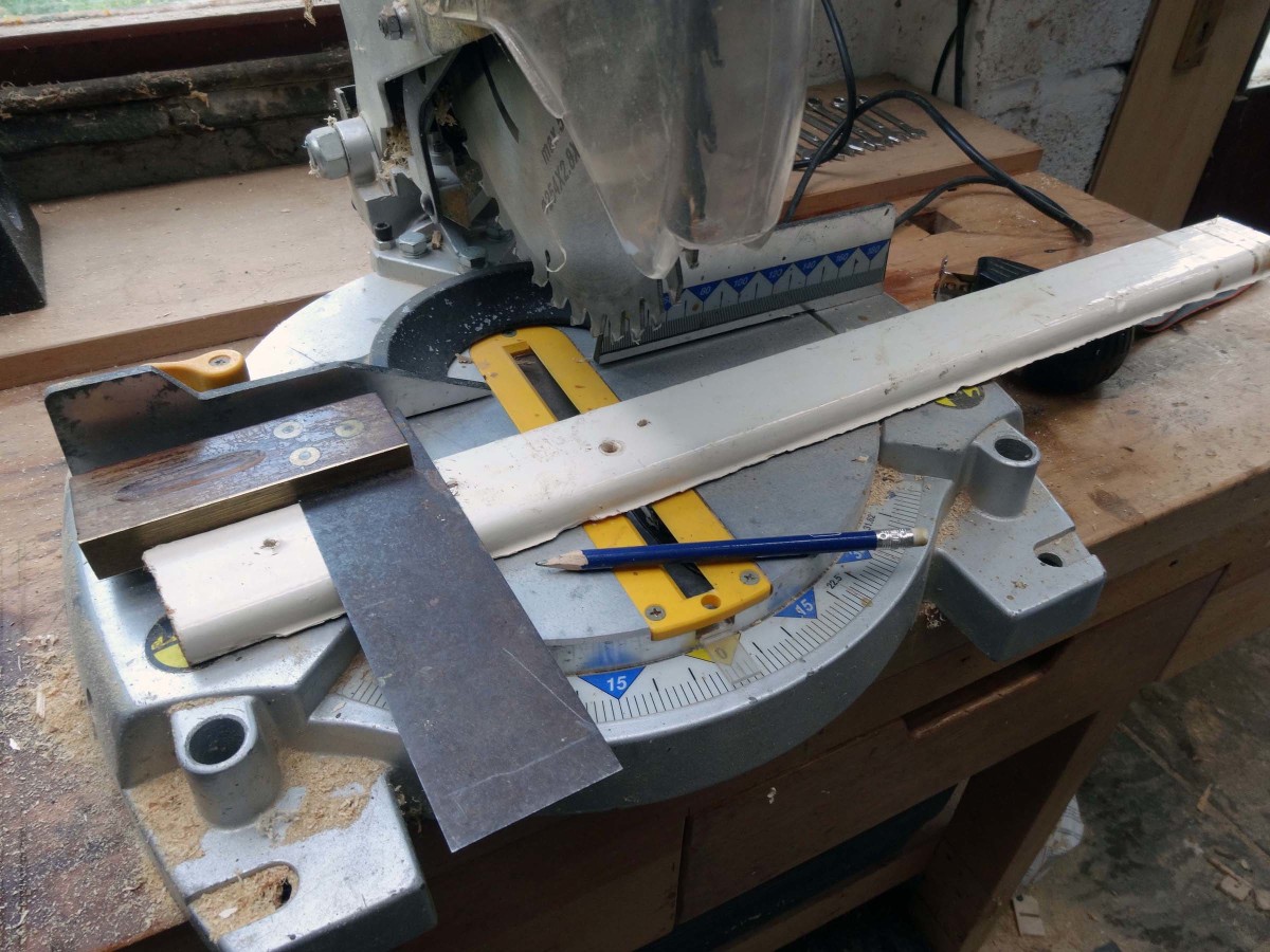 Cutting a suitable piece of scrap wood to the correct length.