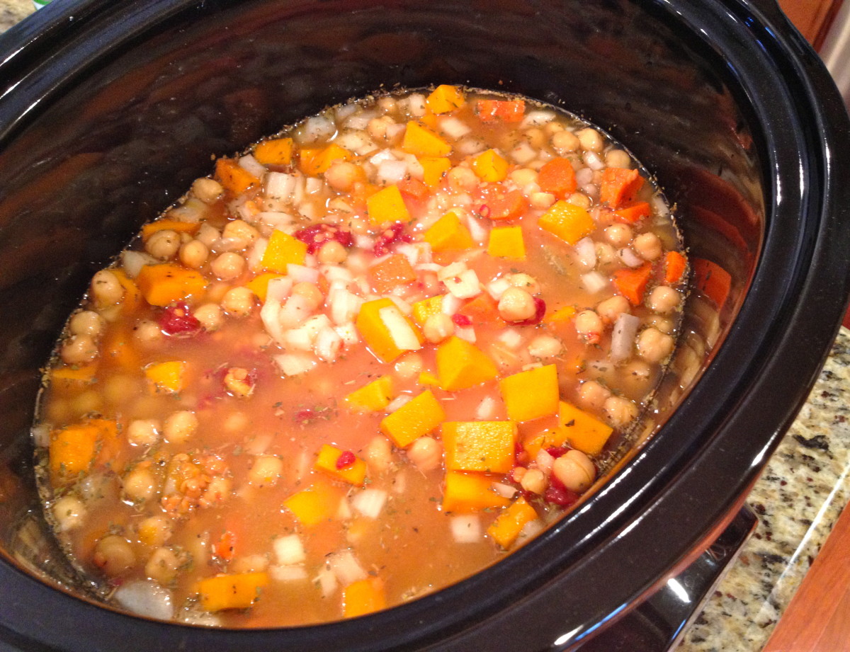 Add broth, tomato paste, garlic, pumpkin and spices.