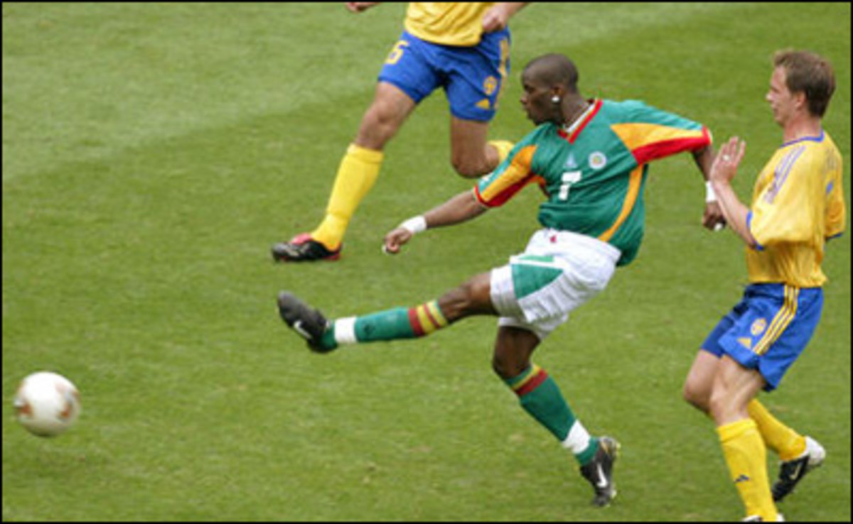 Henri Camara of Senegal takes a shot on goal that proves to be the golden goal against Sweden in a Round of 16 match at the 2002 World Cup in Oita, Japan.