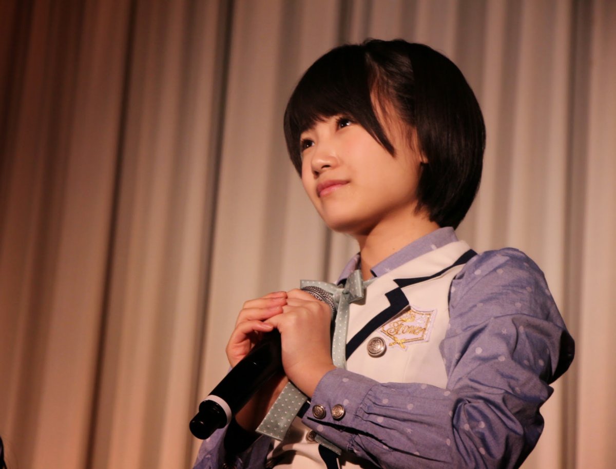 Is Mio Tomonaga about to speak on stage?