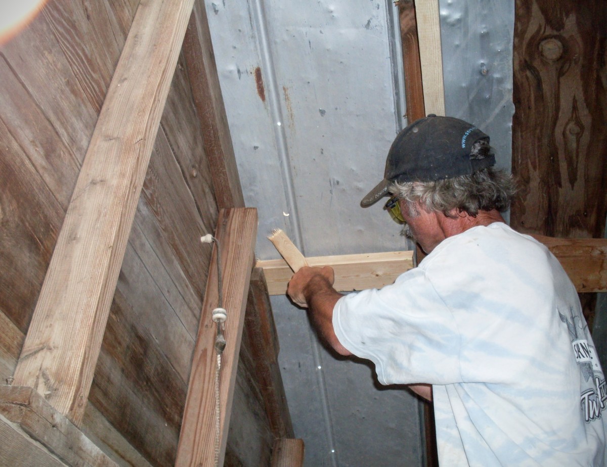 Spacers and shims of scrap lumber were made to align each purlin with any original rafters and purlins, as necessary.