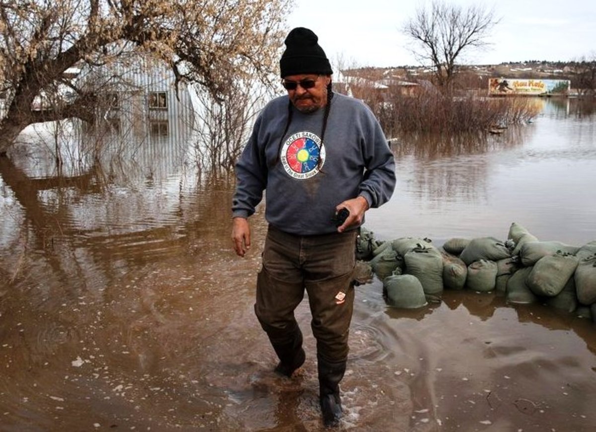Henry Red Cloud helps stop the flooding at the Pine Ridge Indian Reservation in March 2019