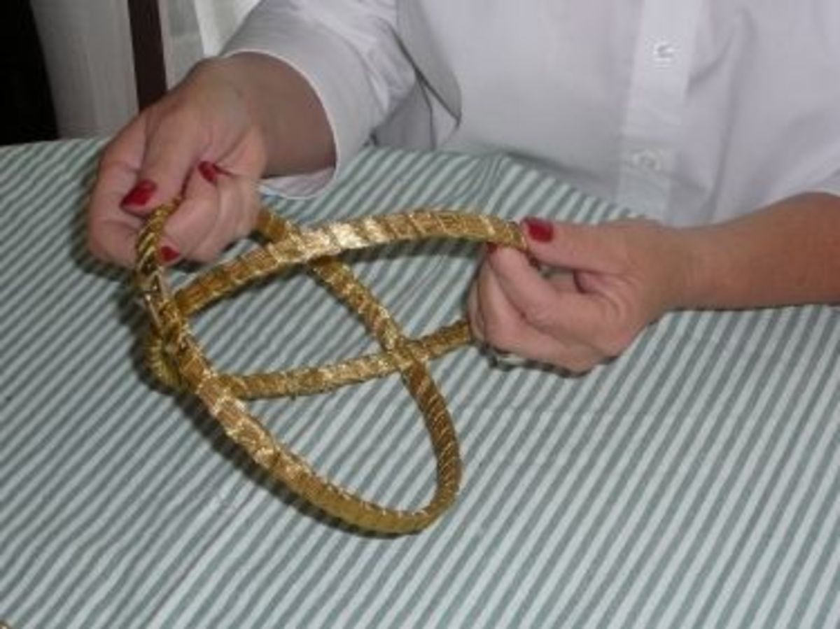 Step 1: Time to fit the two embroidery hoops together, to create the mobile, and the setting for your centerpiece decoration.    The embroidery hoop with the screw will be the top hoop, fit the slightly smaller hoop into the hoop with the screw.