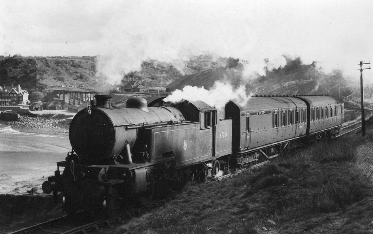 Class L1 67764 of Middlesbrough mpd (51D) returns north-westward along the coast from Whitby/Scarborough with a short off-season passenger working. The route was closed in 1954 between Whitby West Cliff and Loftus