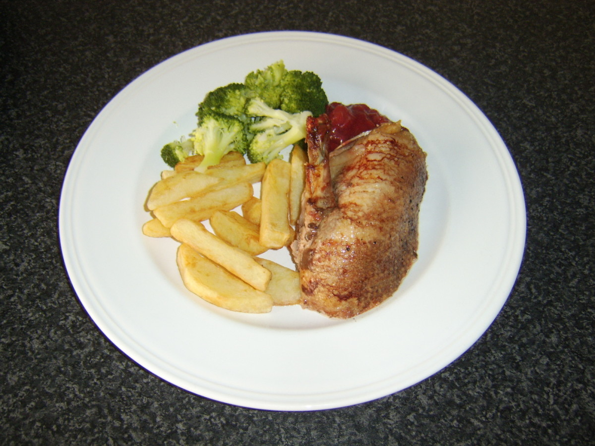 Plum Sauce Served with Roast Duck, Chips and Broccoli