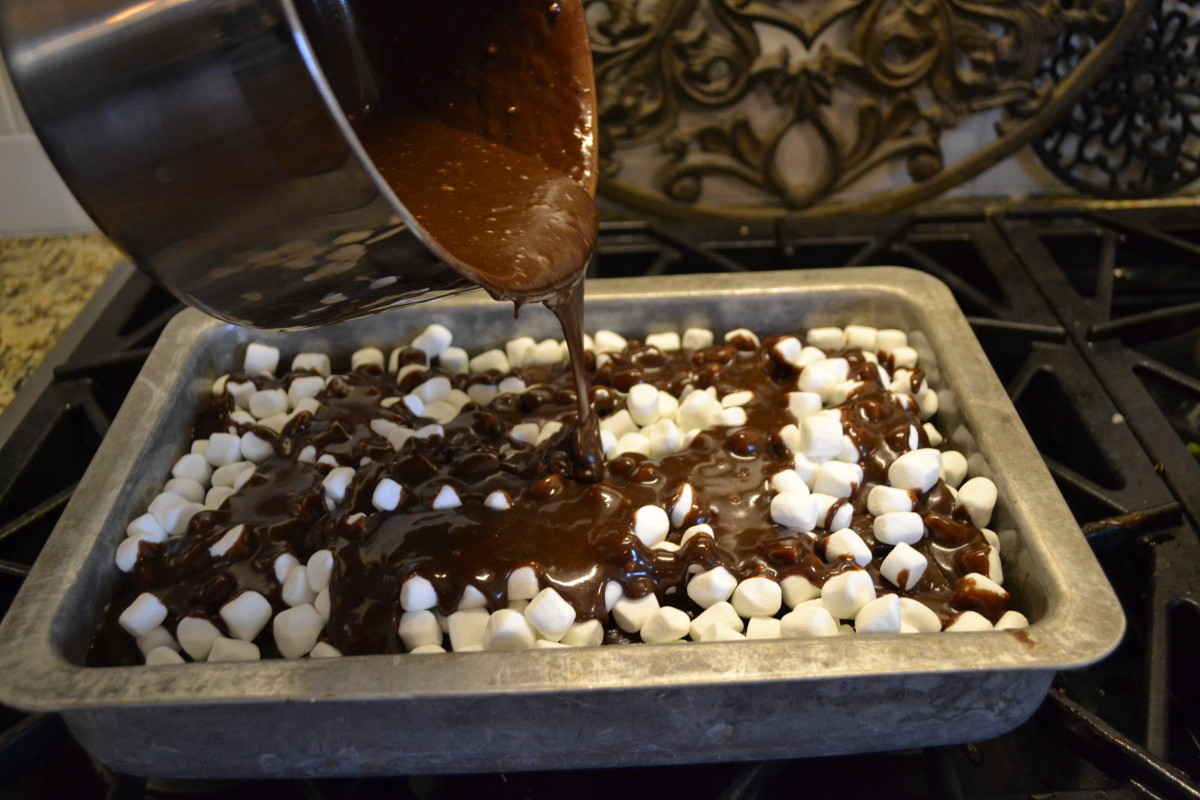 Sprinkle mini marshmallows atop the cake and icing, then pour remaining icing over the marshmallows.