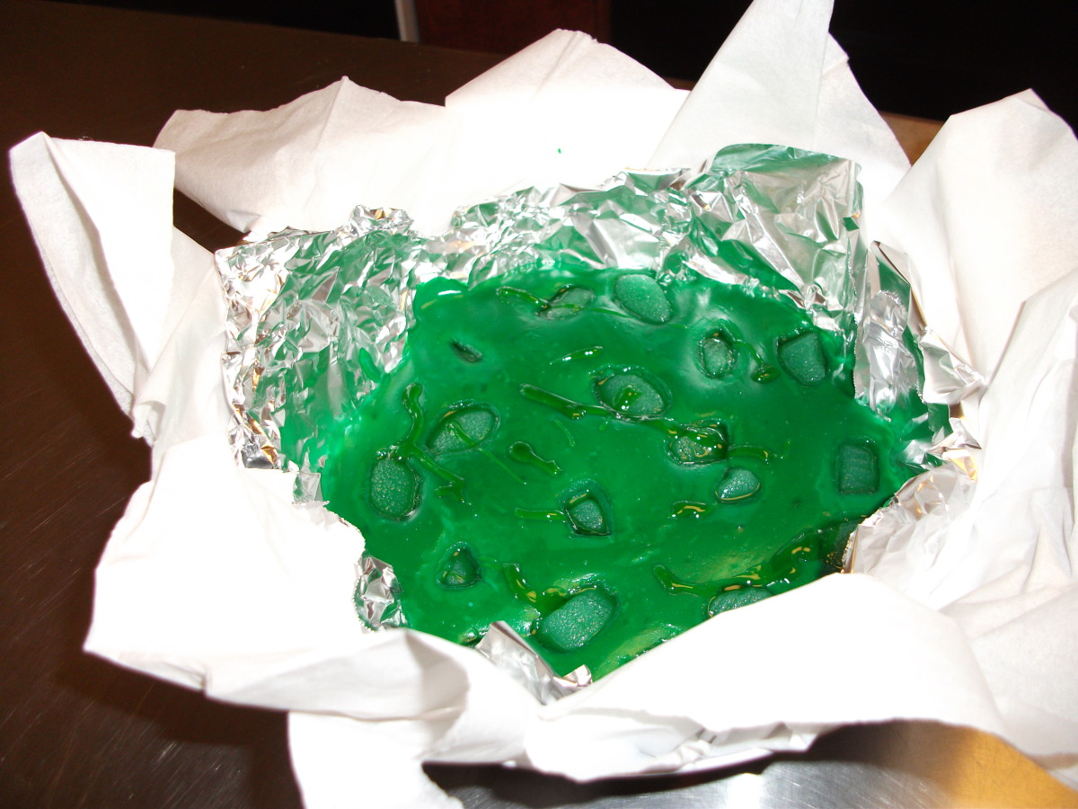 Green colored pudding and candy made to look like snot and boogers.