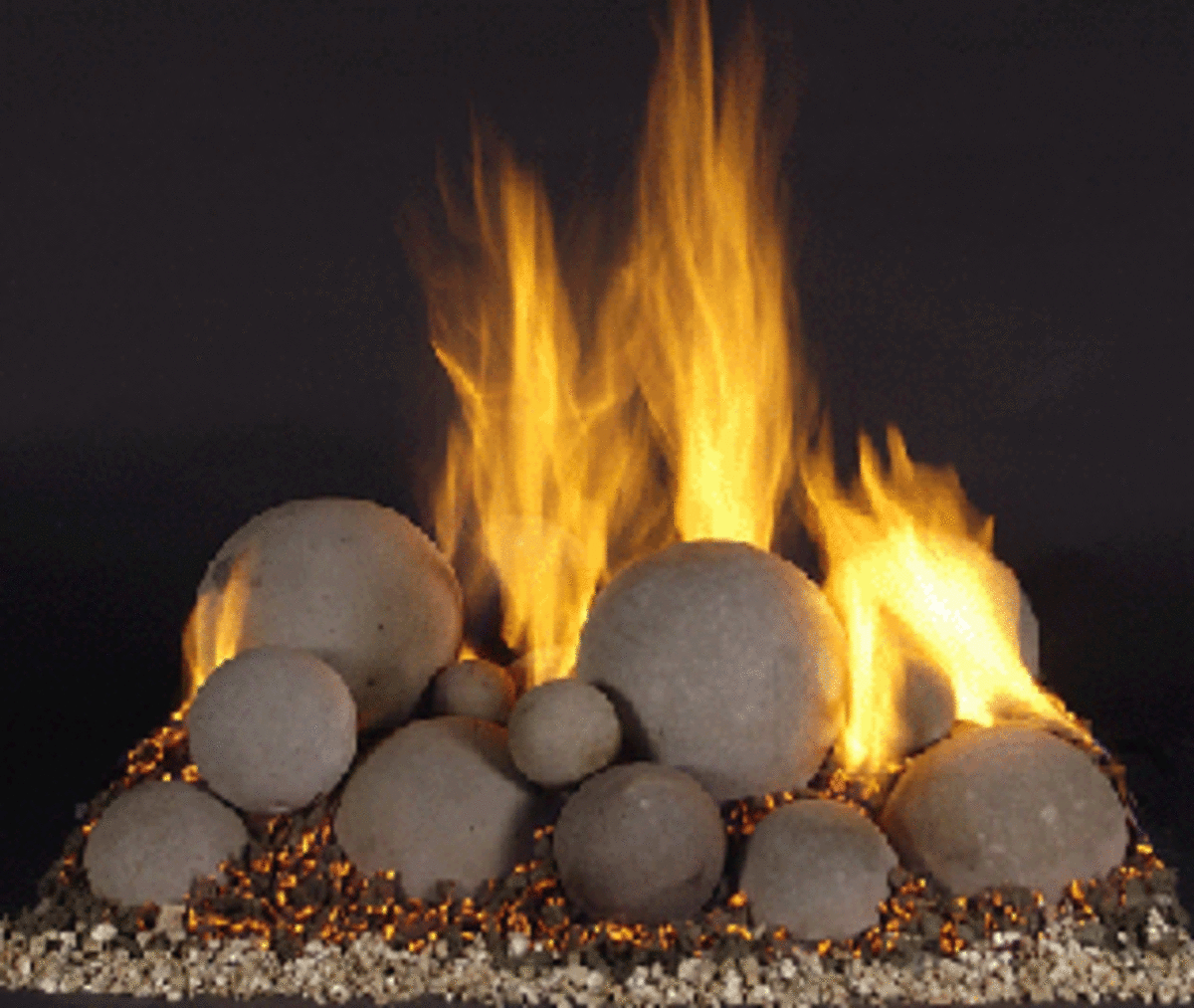 varying sizes of fire balls together in a pan burner fireplace.