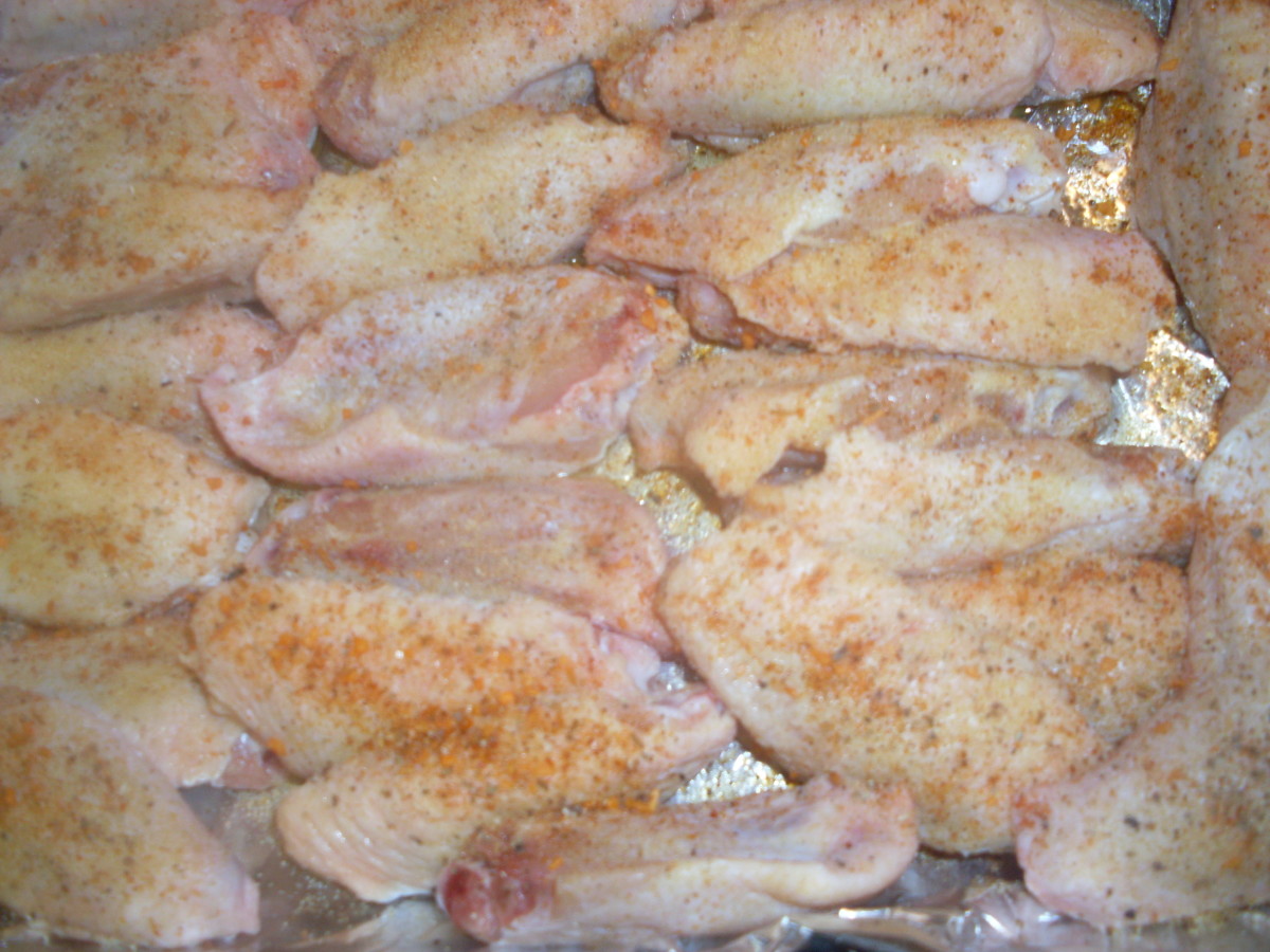 raw, generously seasoned chicken wings 