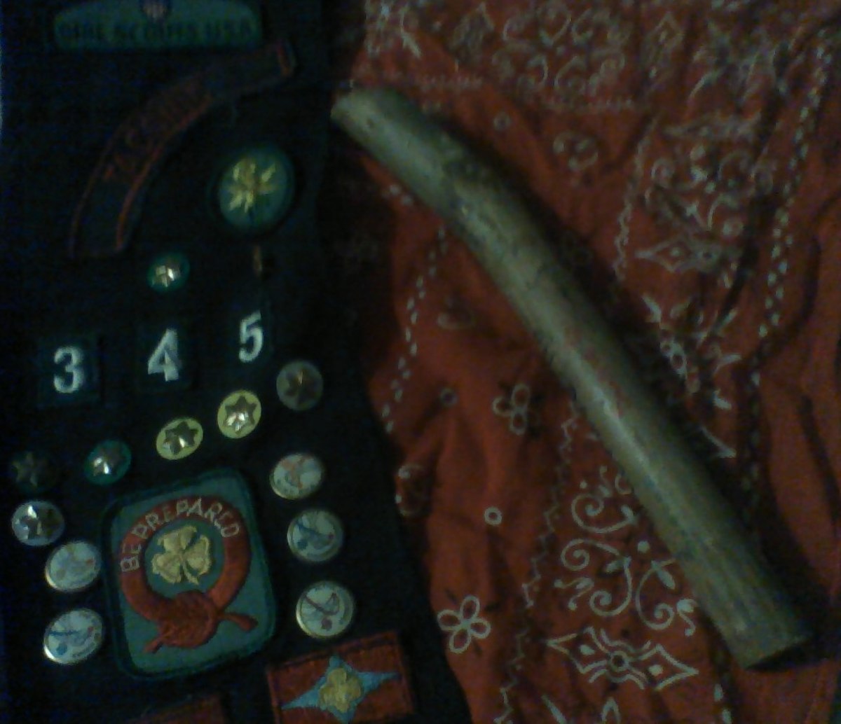 My girl scout sash, the bandanna I loved to wear, and the friendship stick from camp