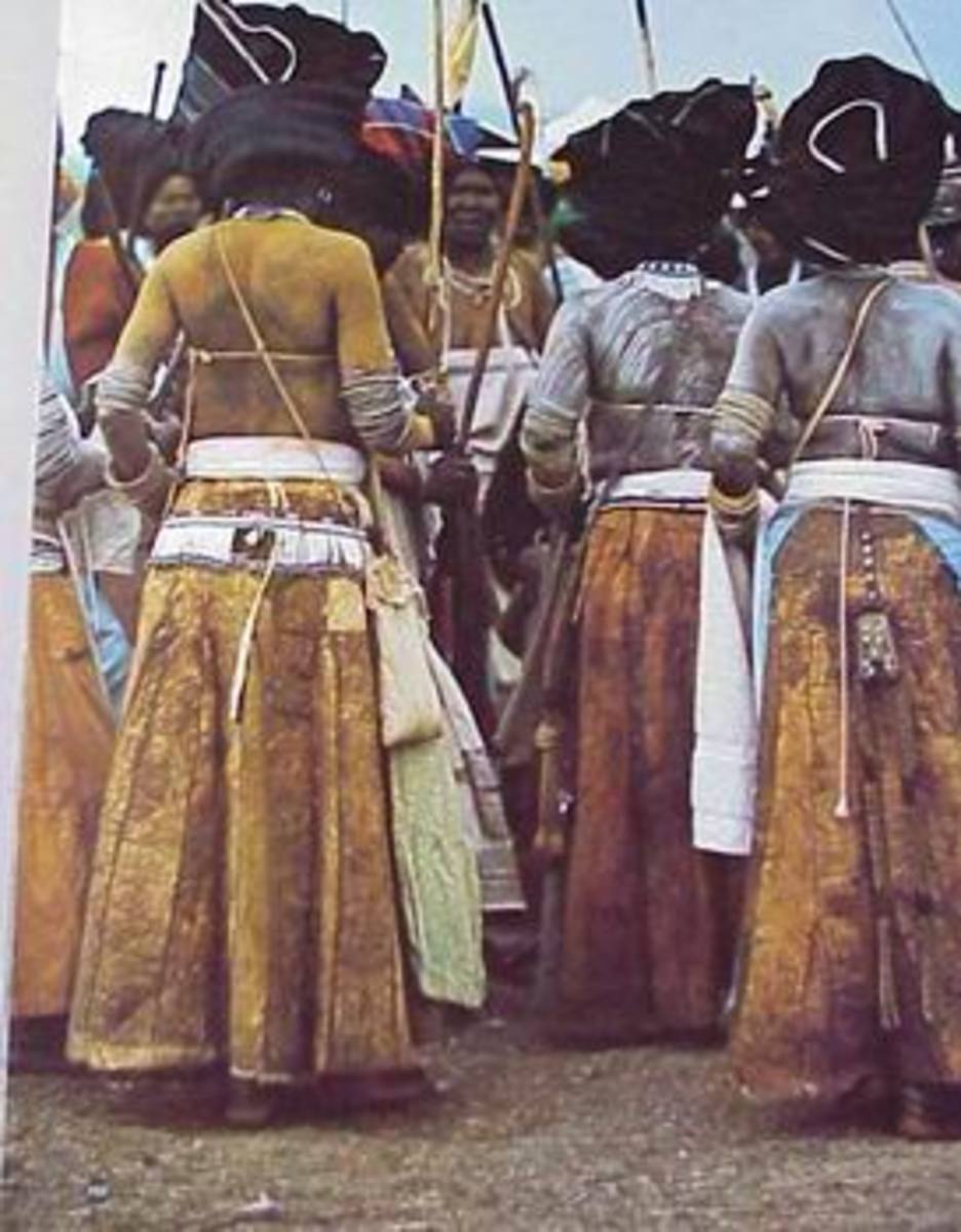 Xhosa women wearing their headdresses, long skirts and their leather purses