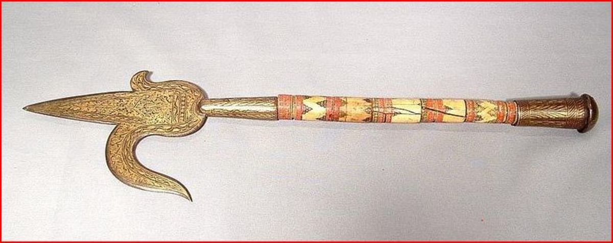 An 18th Century decorated Indo Persian Elephant Ankus with ivory handle. Overal length nineteen and a half inches