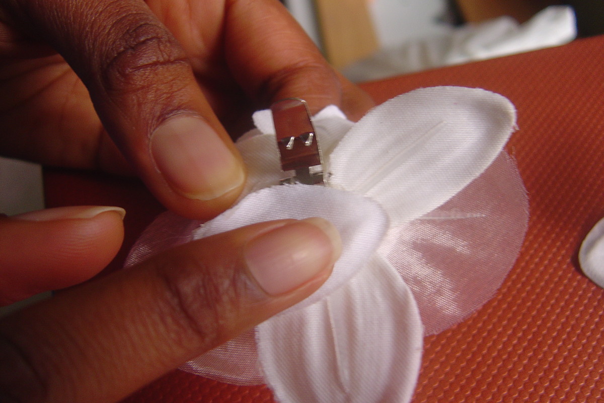 Place one of the flower petal piece over glue area. Let it set for about 5 minutes. Your flower shoe clips are ready to use. Repeat steps 1 through 4 for the other half.