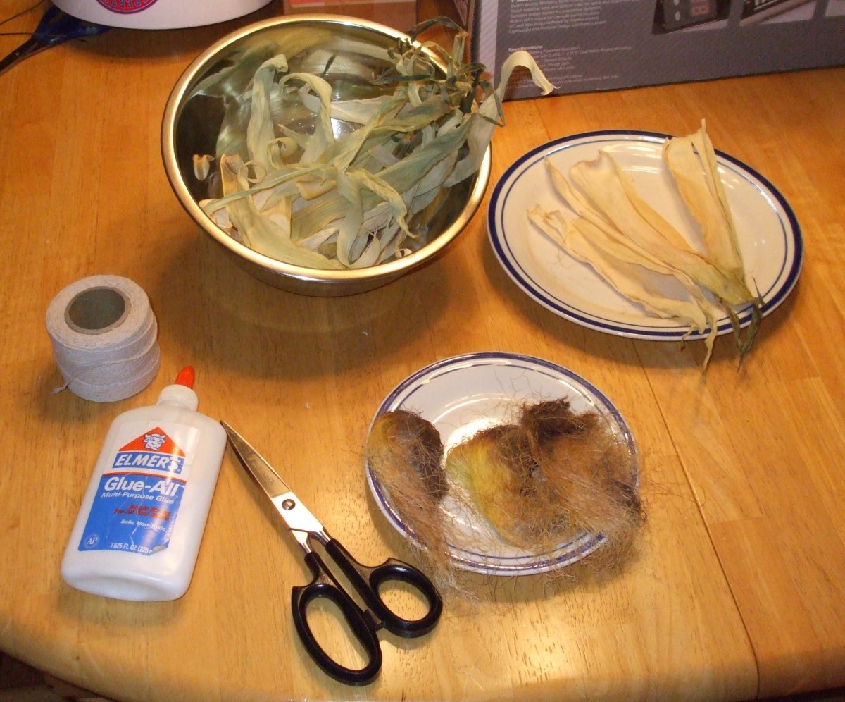 Corn husks (the leaves from an ear of corn),corn silk, string, glue, and scissors.