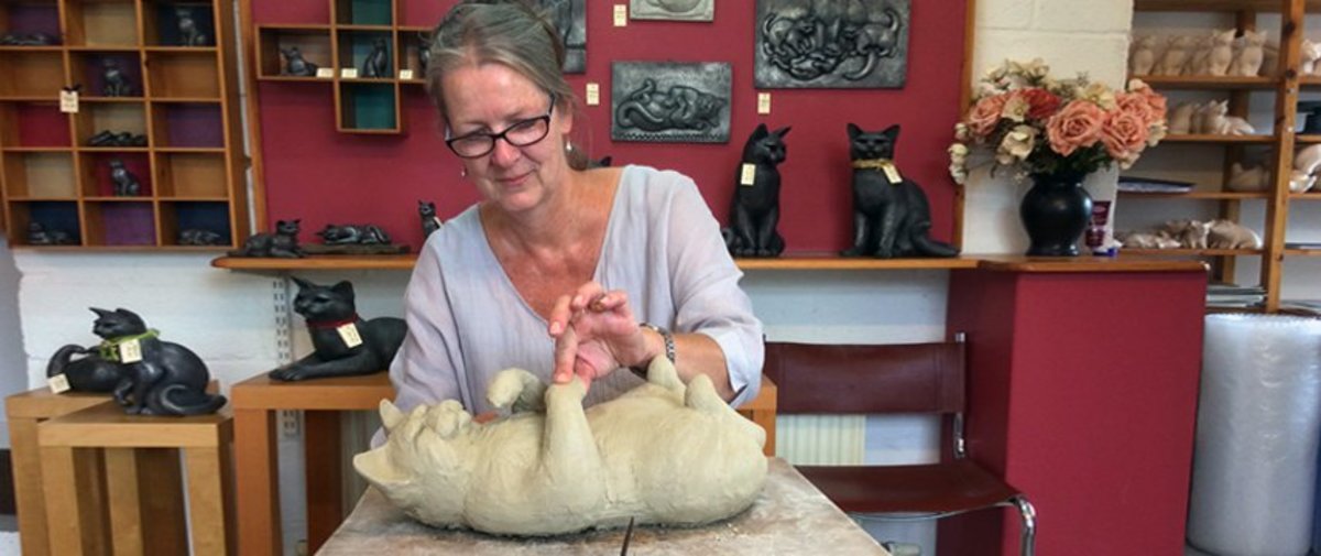 Moorside Design Cat Pottery - Shirley Nichols in earlier days adds finishing touches to one of her designs