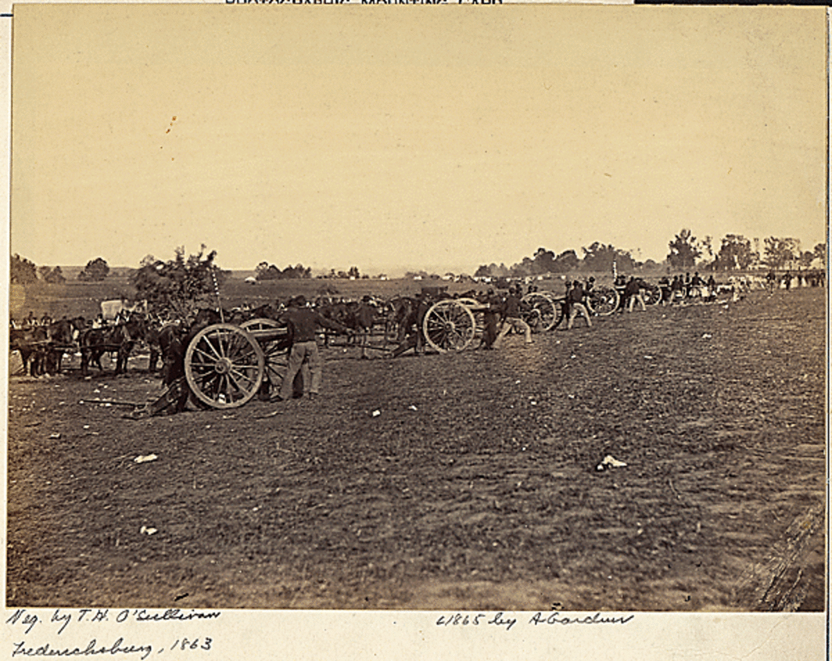 A posed photograph of Union artillerymen as they load their cannon outside of Fredericksburg, VA