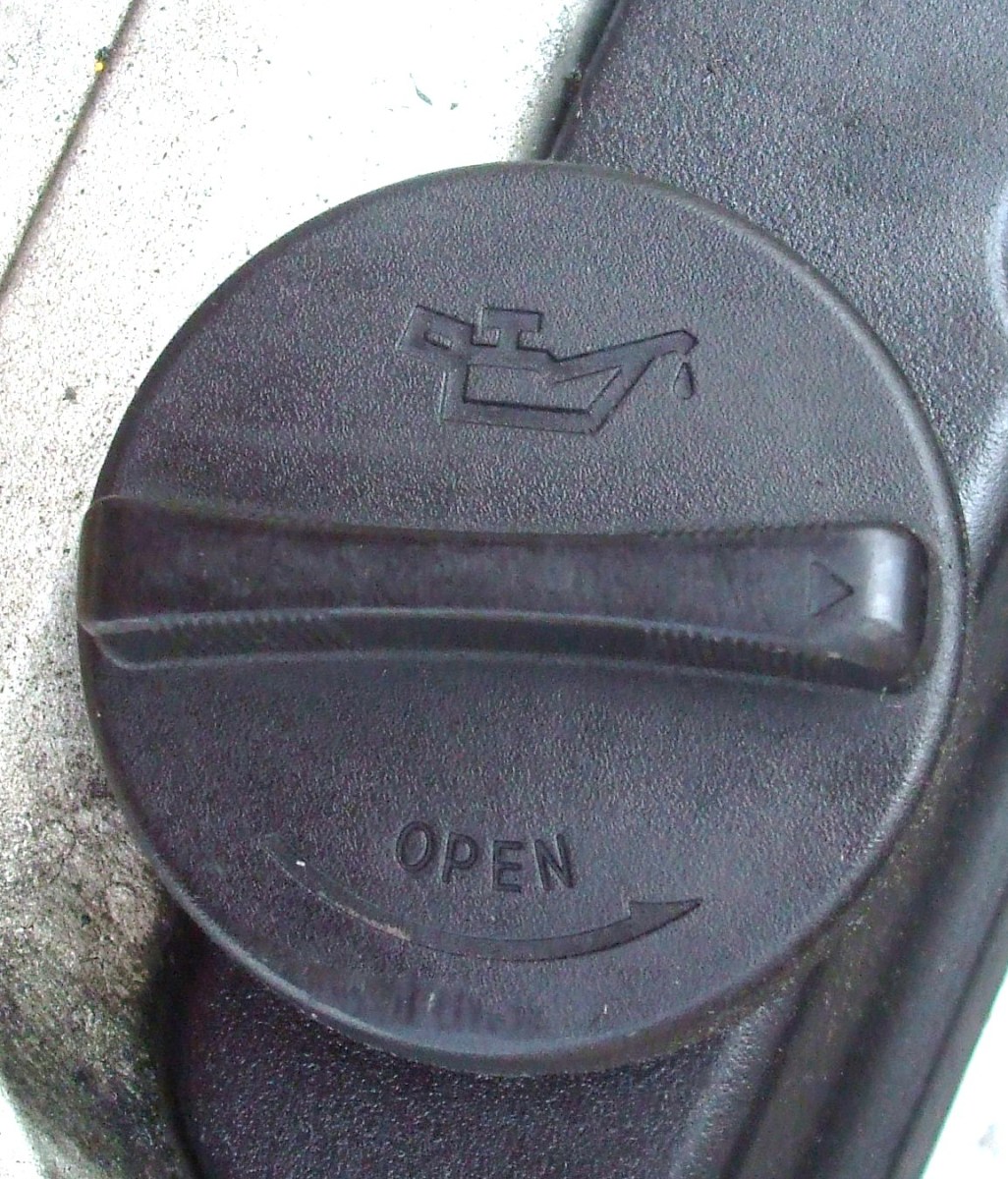 This cap has the Oil icon.  Open it to add more oil.