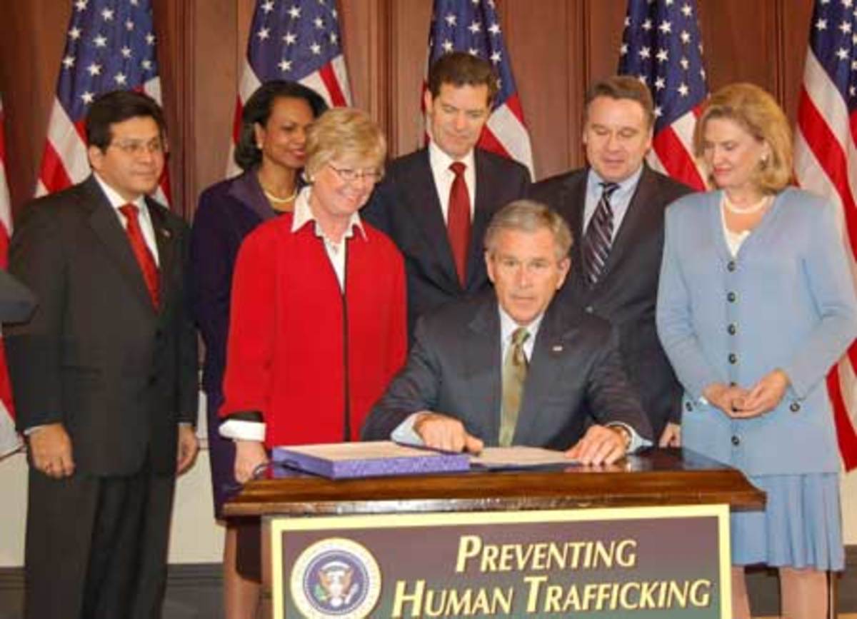President George W. Bush Signs the Trafficking Victims Protection Act (TVPA)
