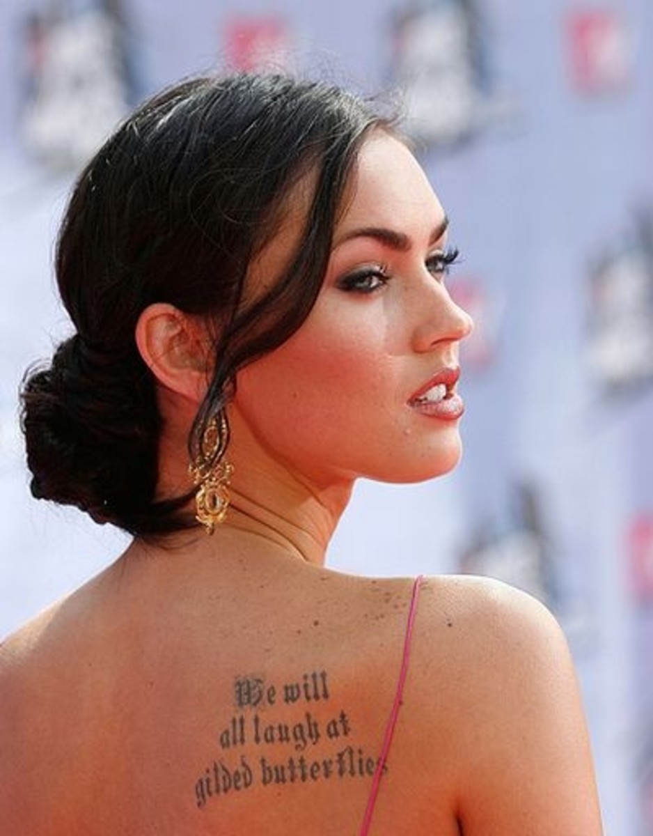Megan Fox Is Covered in Tattoos See Photos of the Actress Body Art From  Her Back to Pelvis Tattoo