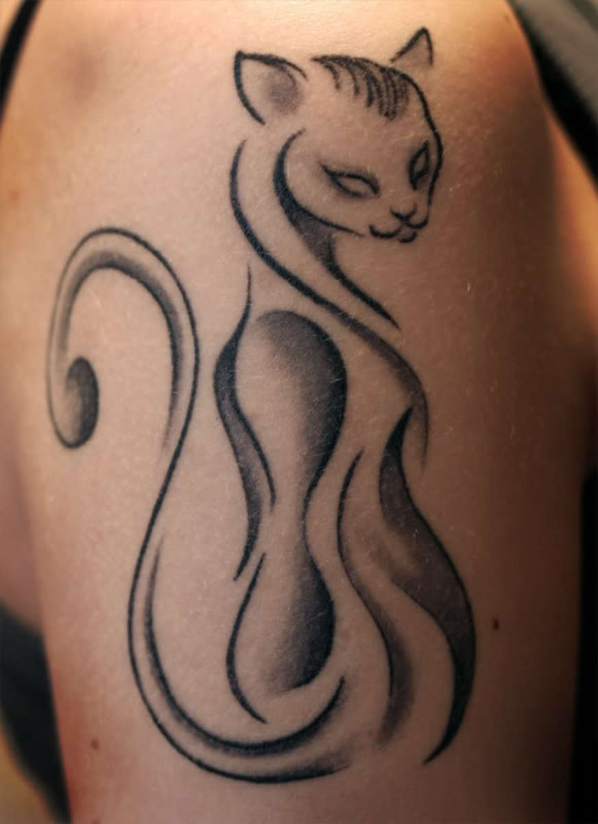 The simplicity and lean lines makes this tattoo stand out. With those blank eyes, you know this cat is up to no good.