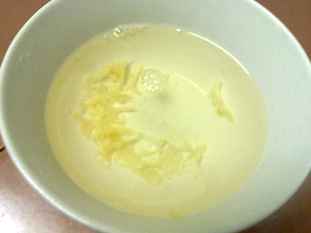 a small bowl of freshly pound garlic water