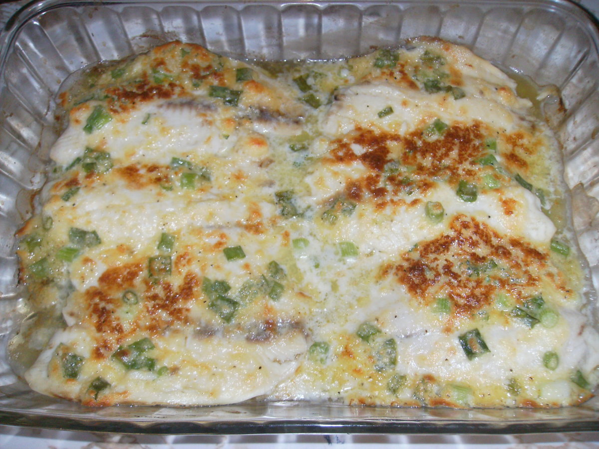 Baked parmesan cheese tilapia fresh out of the oven. You won't believe how delicious this fish is until you try it!