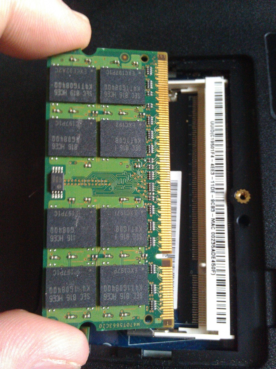 The RAM card properly aligned  (right side up) with the notch in the slot.