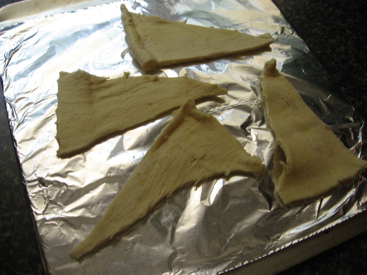 Unroll dough on foil-line cookie sheet that has been sprayed with cooking spray. Divide dough into eight triangles.