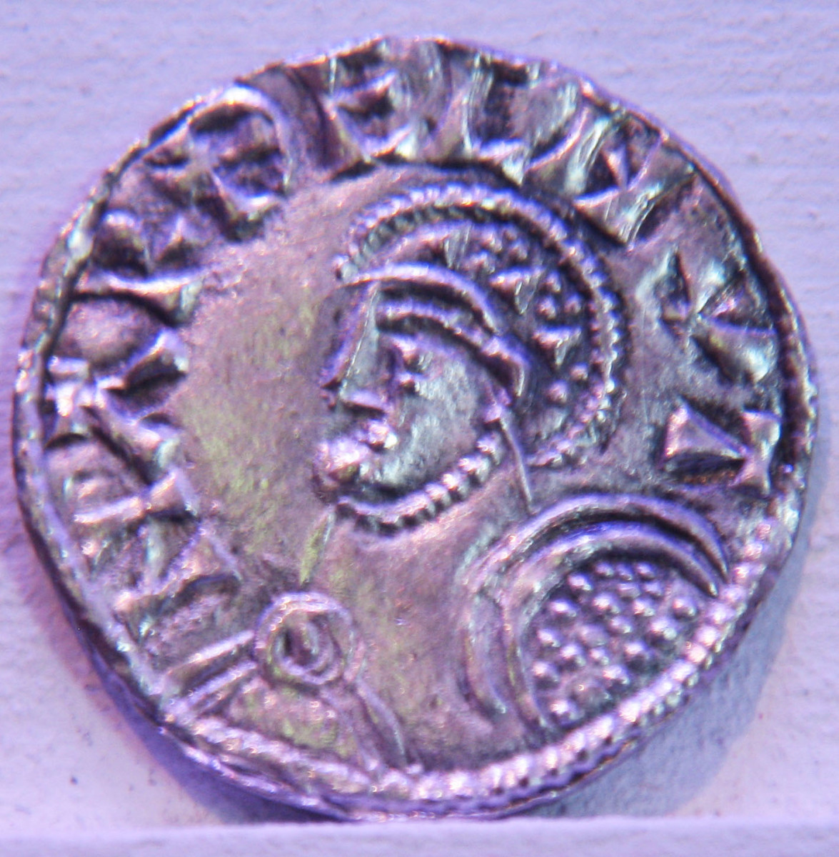 A coin from the reign of Harthaknut Knutsson (Knudsen) depicts him in a classical form of portraiture. Greco-Roman realism did not enter minting of coins until fairly recently