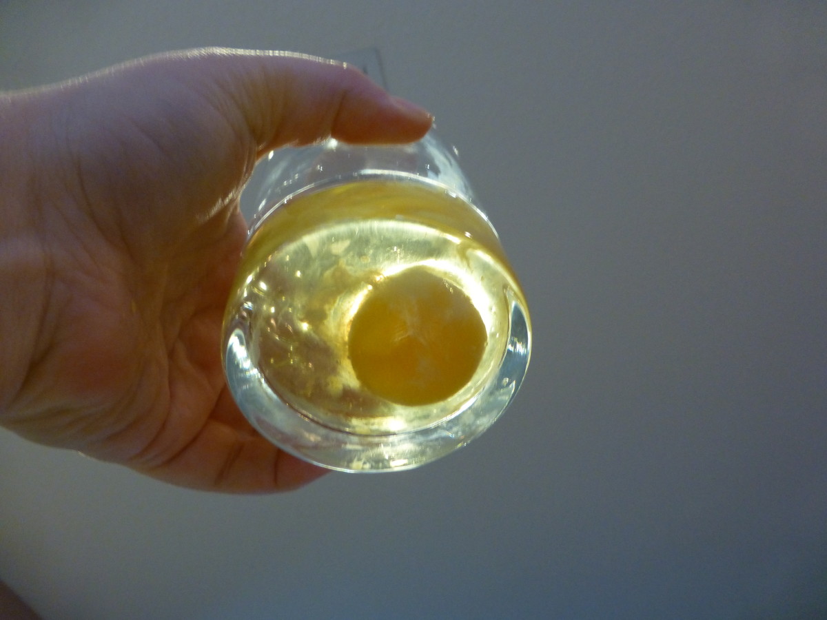 Then hold the glass up to a light source and inspect the bottom of the yolk.
