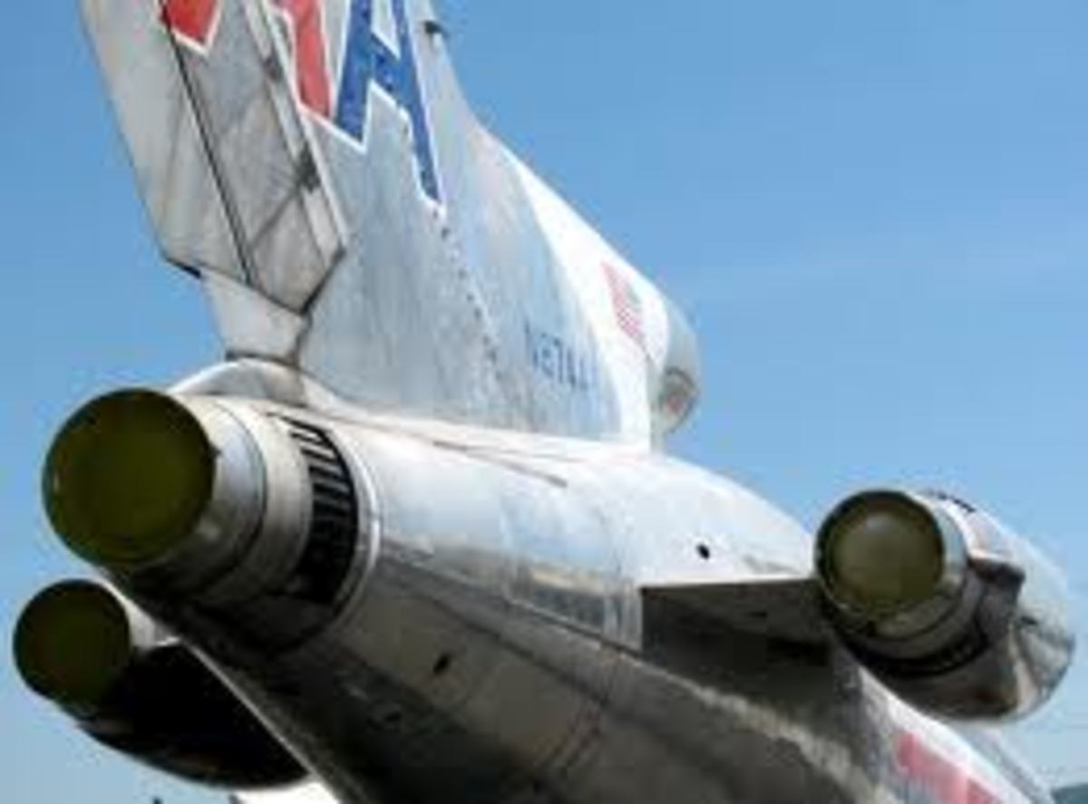 (Note: Rear view of the Boeing 727 engine mounting configuration on and in the tail of the fuselage. The displaced inlet duct opening for be center engine can be seen at the front base of the vertical stabilizer.)