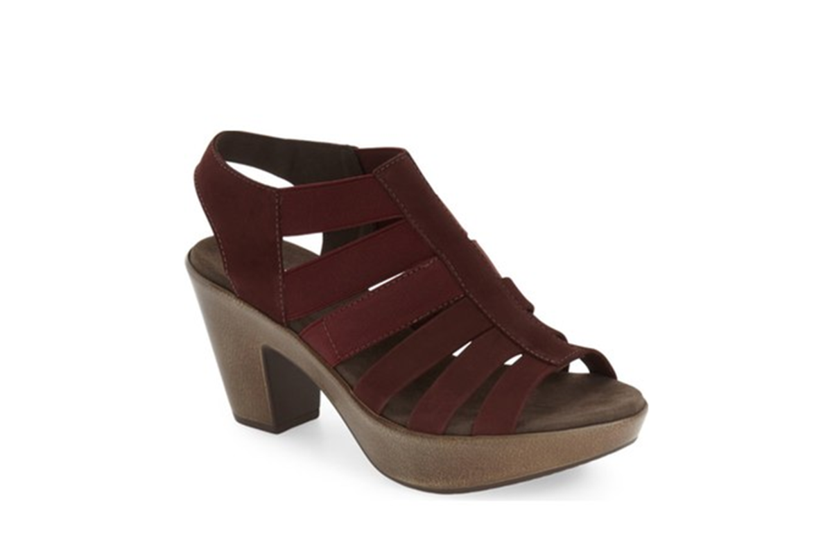 Stylish platform sandal with chunky heel and slingback strap. The molded and shock-absorbing sole make it comfortable. Mix of leather and elastic laddered straps, 3 inch heel, 1.5 inch platform.