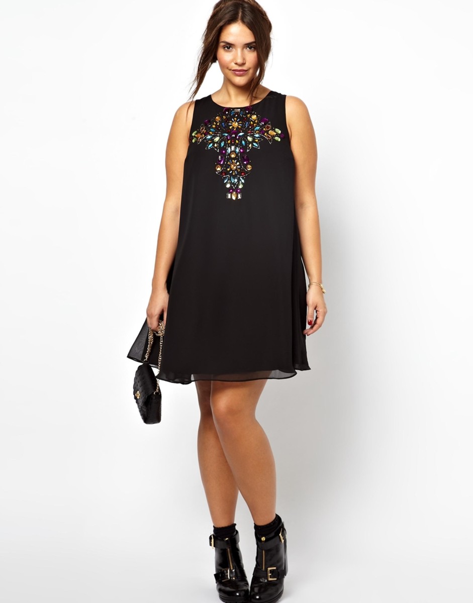 Sleeveless chiffon swing dress with stone embellishment on chest