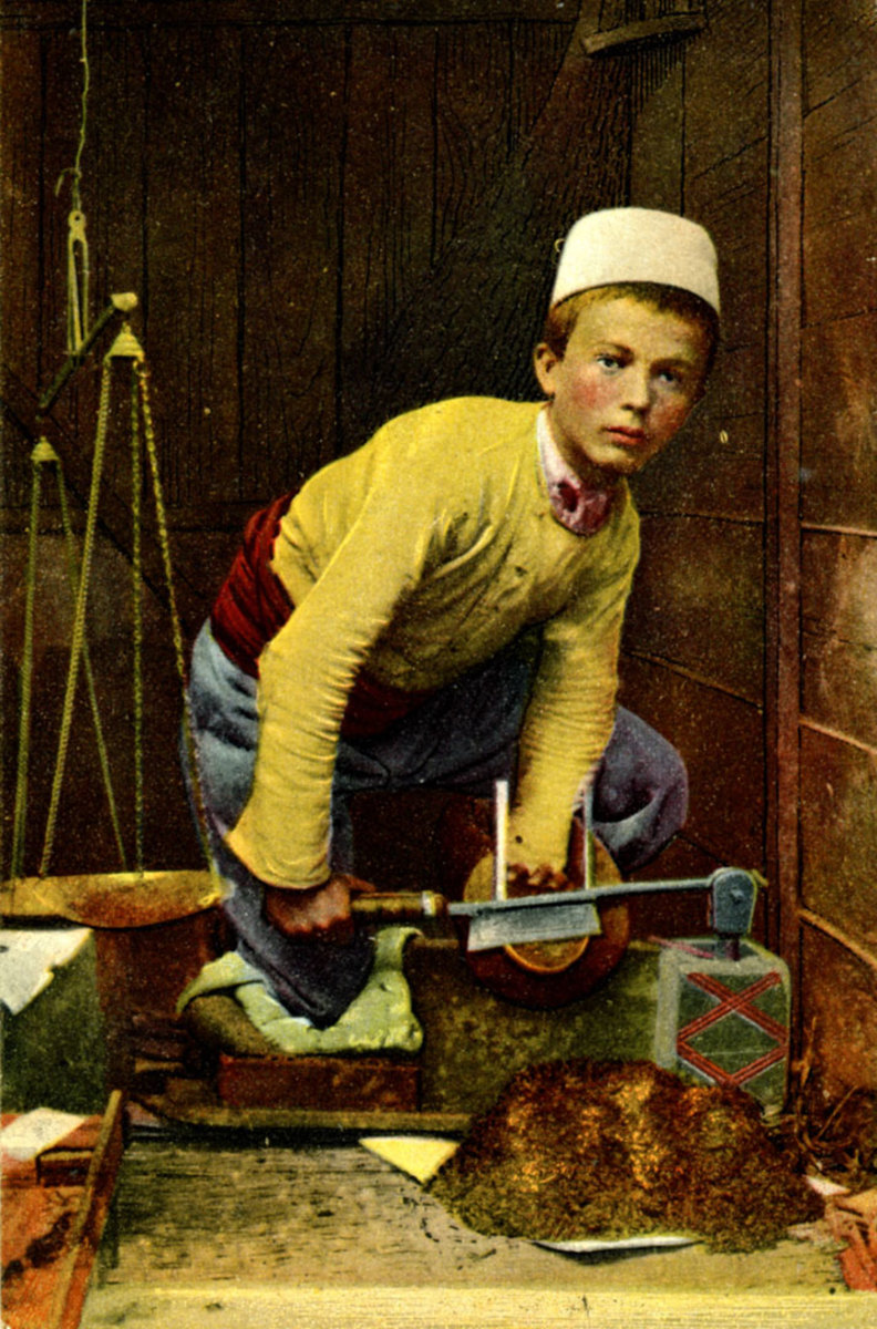 A young Albanian boy works at traditional crafts.