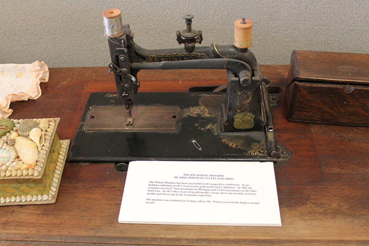 Early model 1800s machine in a fixed position.