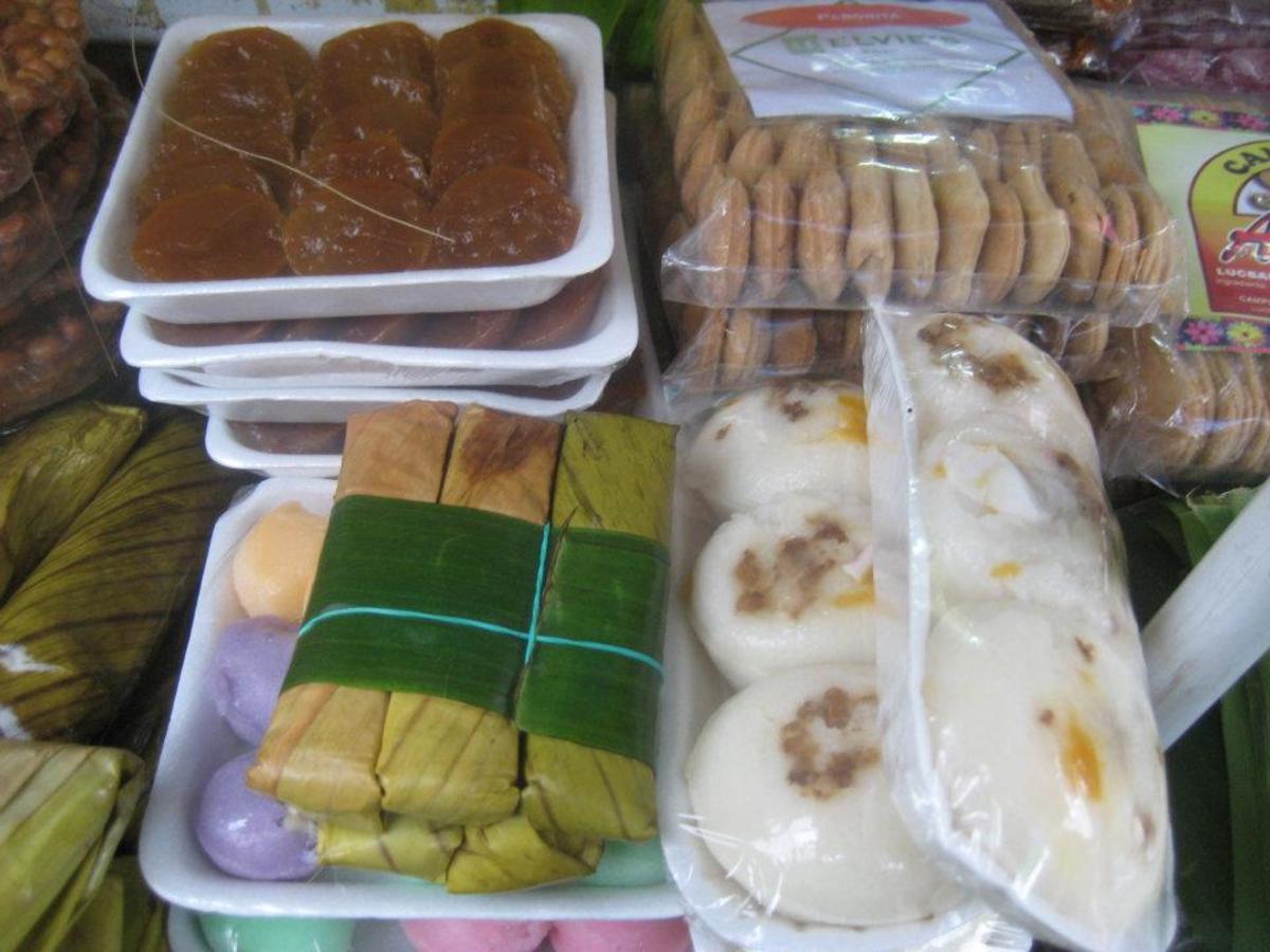 Rice Cakes (white and colored ones) along with other Filipino delicacies