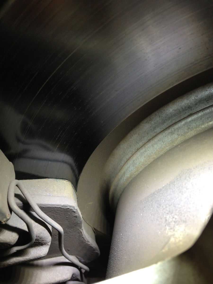 Modern wheels with wide spokes make it easier to check brake-pad thickness.