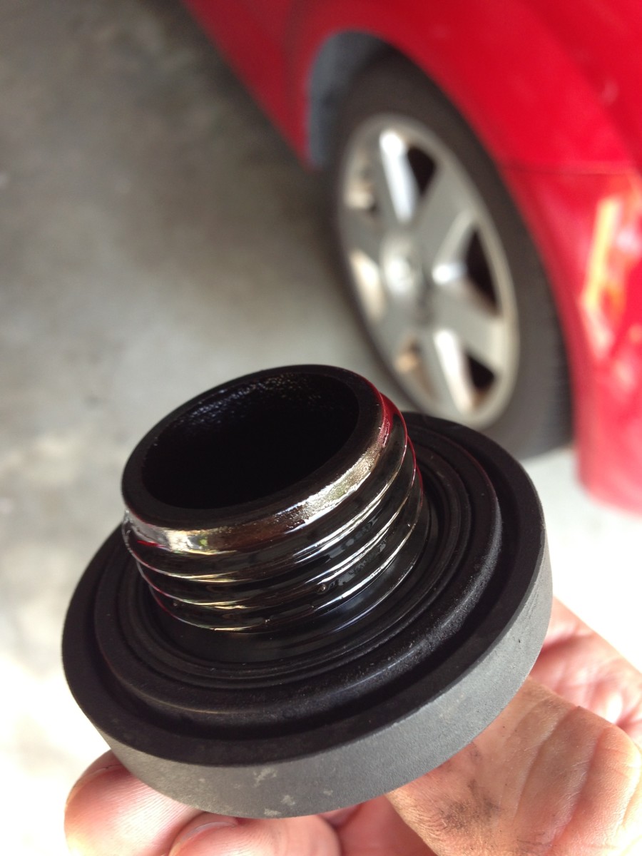 This oil filler cap from a Honda Pilot with over 220,000 miles is looking good with no "white" or "milky" signs of oil/coolant-mixing.