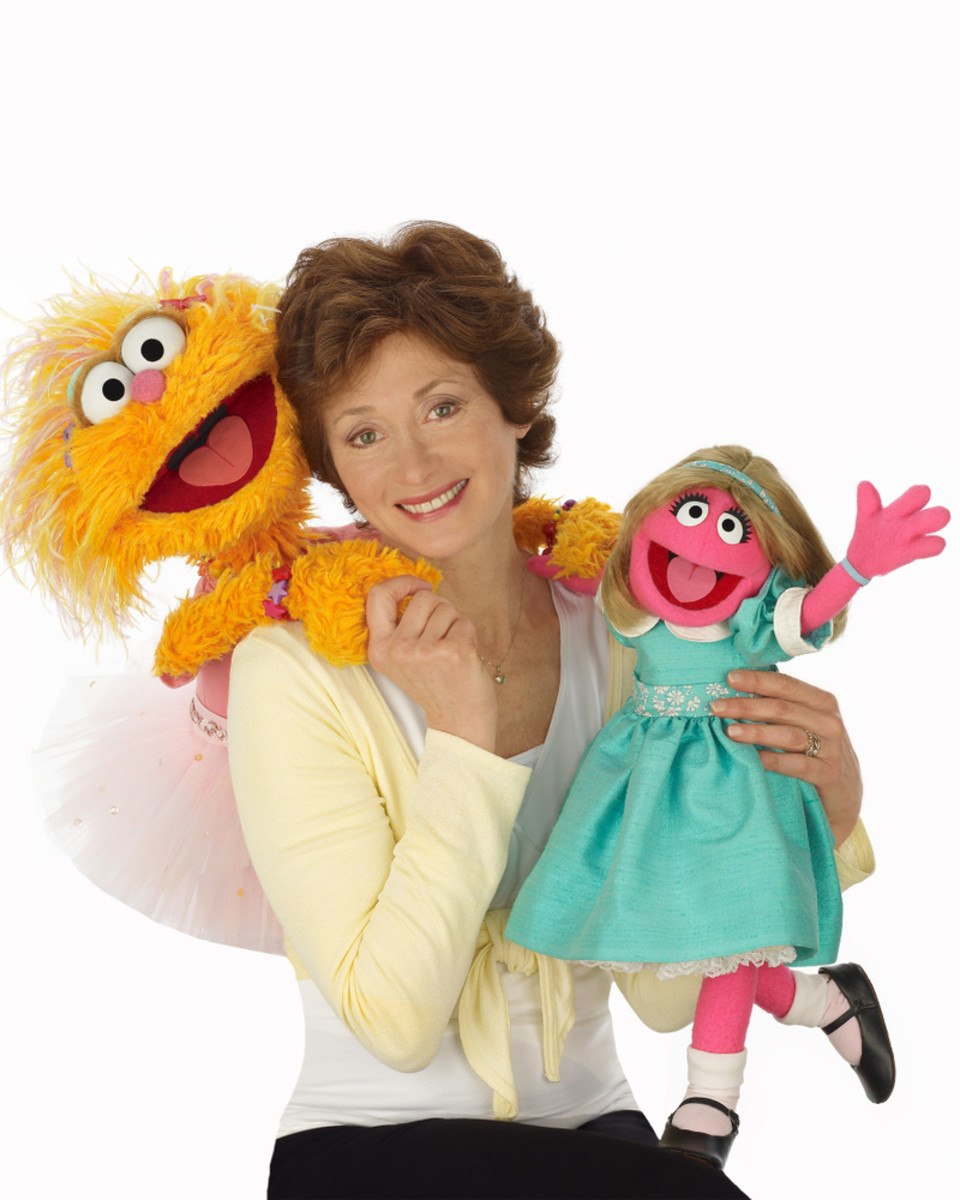 Fran Brill with two of her most popular characters, Zoe (left) and Prairie Dawn.