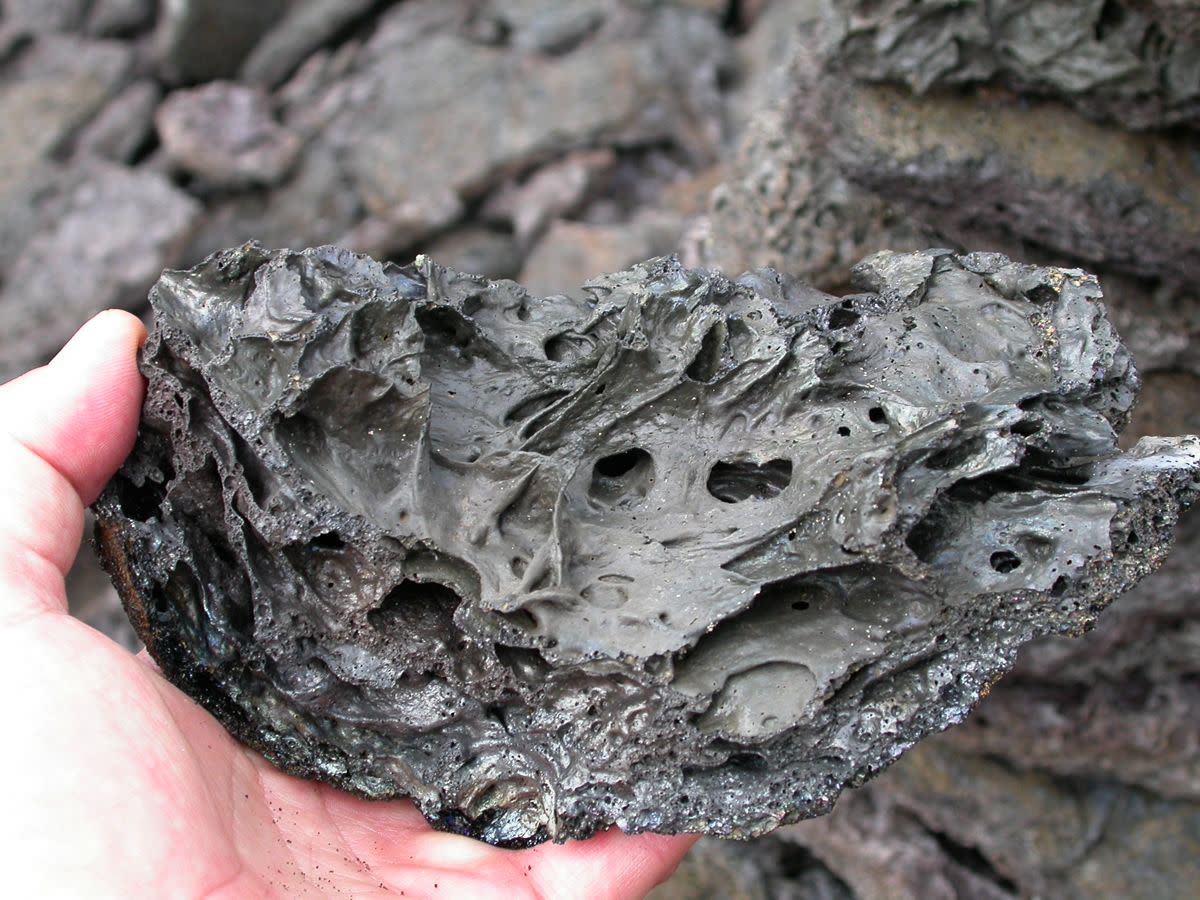 This is a photo of Hawaiian Basalt the type Coco Joe would use in his creation. Coco Joe would pulverized it to a fine black shinny power and then mixed with a very hard resin to make an incredibly strong lasting rock-hard creation of lasting beauty.