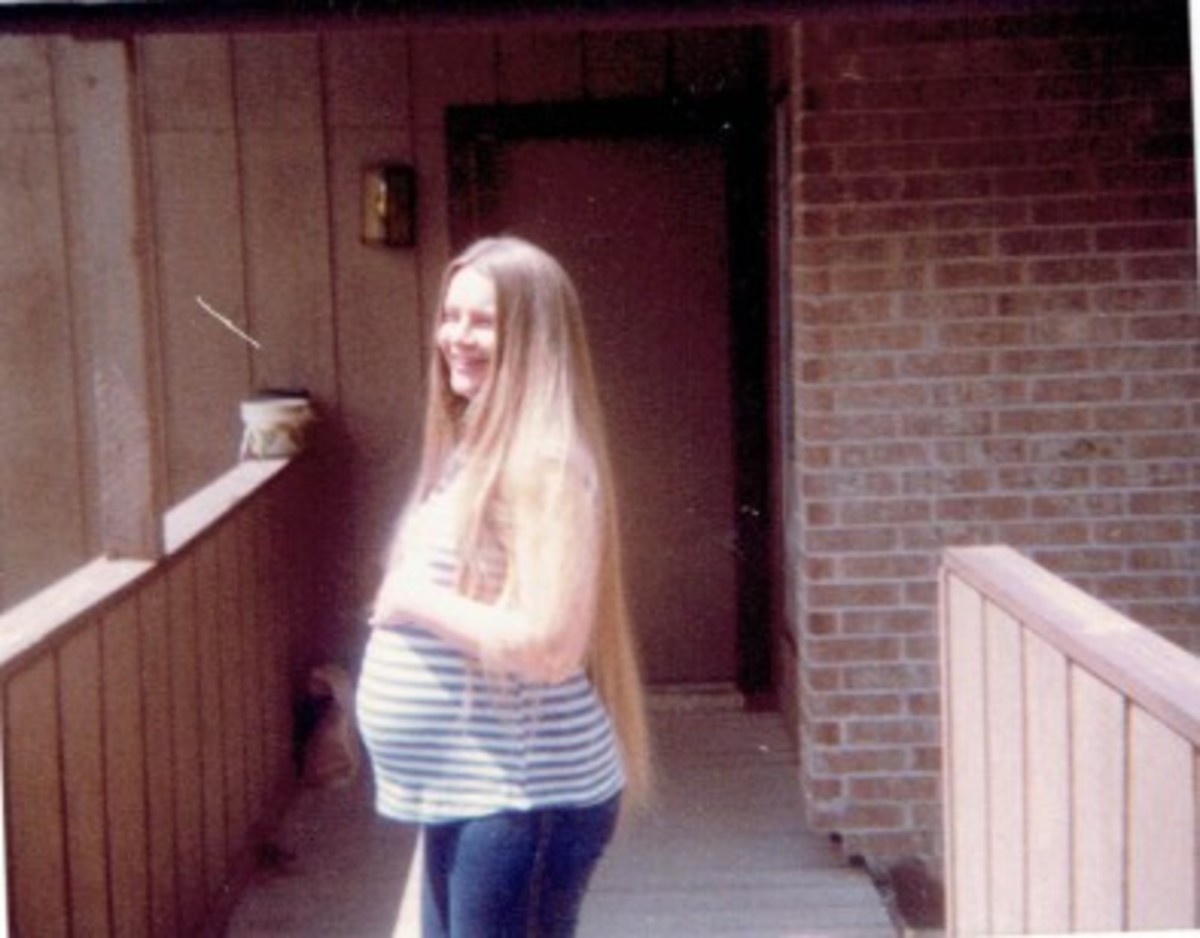 There I am pregnant with my first born child, my beautiful daughter.  Just look at that crazy long hair! I was so huge that when people saw me coming they would move out of my way.