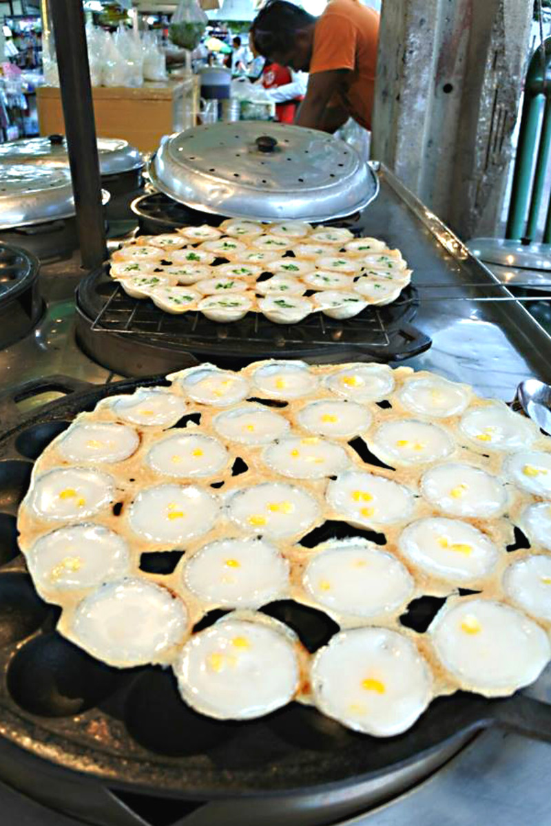 'Khanom krok' with a sweet corn topping, prepared and ready for sale 