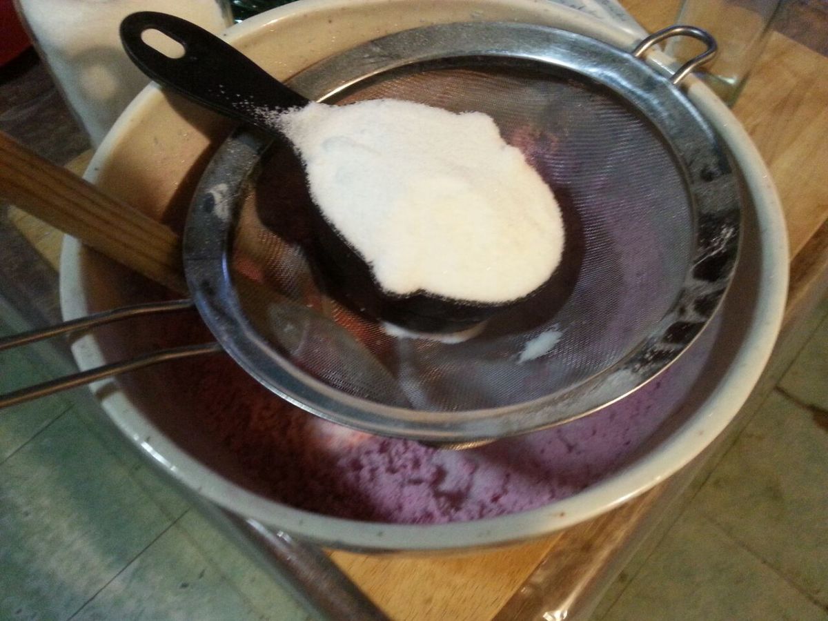 Straining the citric acid into the mixture