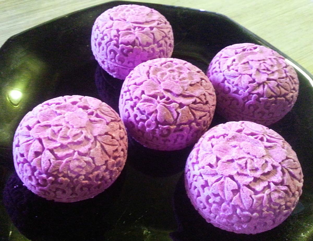 Nag Champa scented bath bombs, colored with purple mica with an added touch of a neon pink.