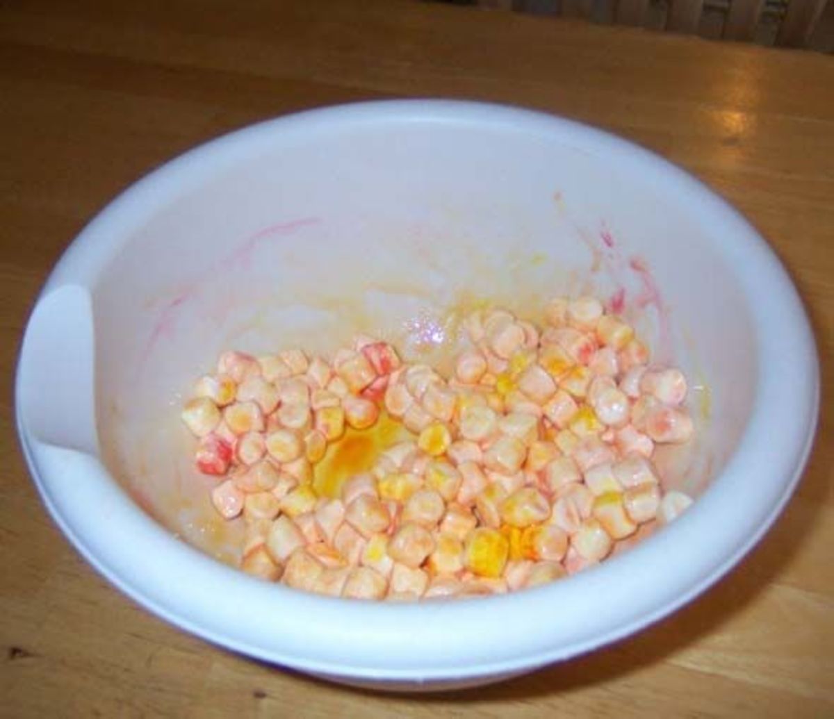 Marshmallows in a bowl with food coloring and water