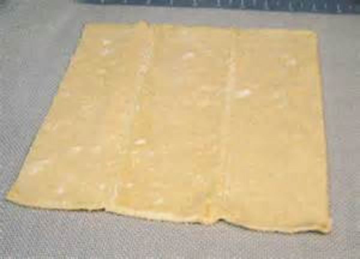 defrost puff pastry and lay out on parchment paper