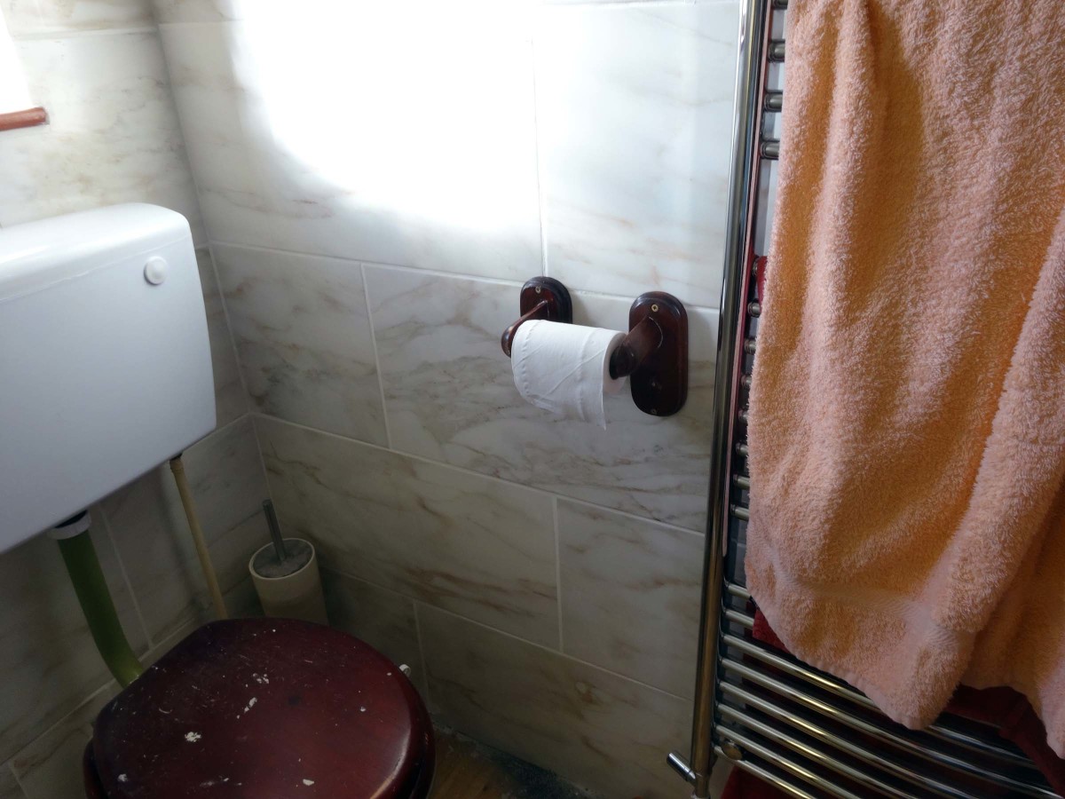 heated towel rail and cistern